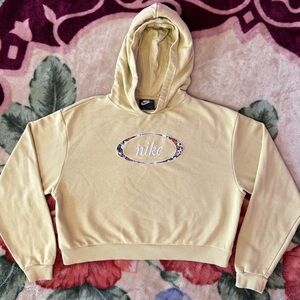 nike light yellow cropped pullover hoodie.